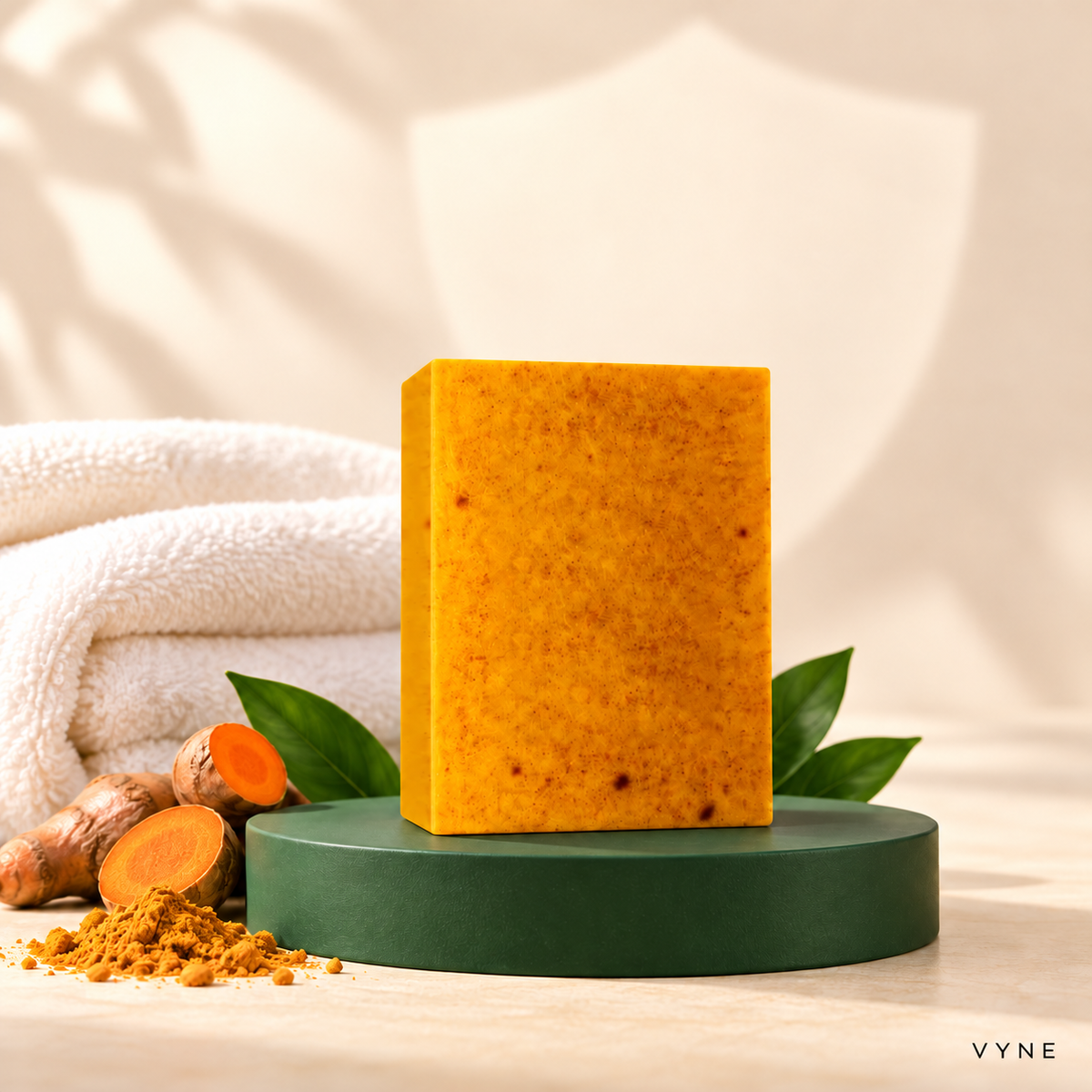 VYNE golden-orange turmeric fade bar on a deep green product stand